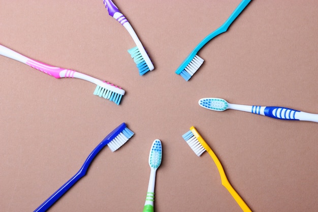 Toothbrushes on a colored background top view oral hygiene