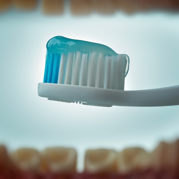 Toothpaste and toothbrush. View from the mouth