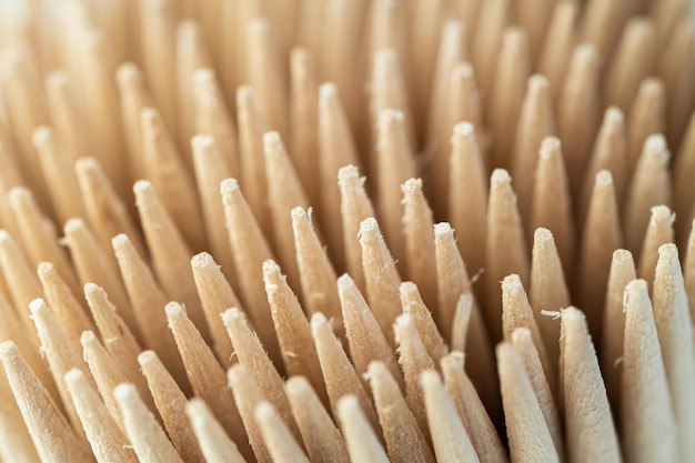 Toothpicks in a box on a gray background closeup