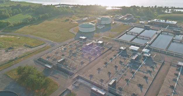 Top aerial view of purification water tanks of modern wastewater treatment processing plant