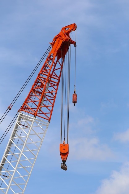 Top of crane on blue sky background