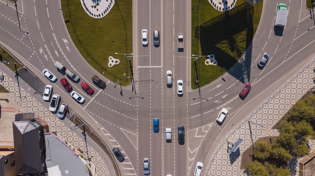 Top down view of road junction with moving cars