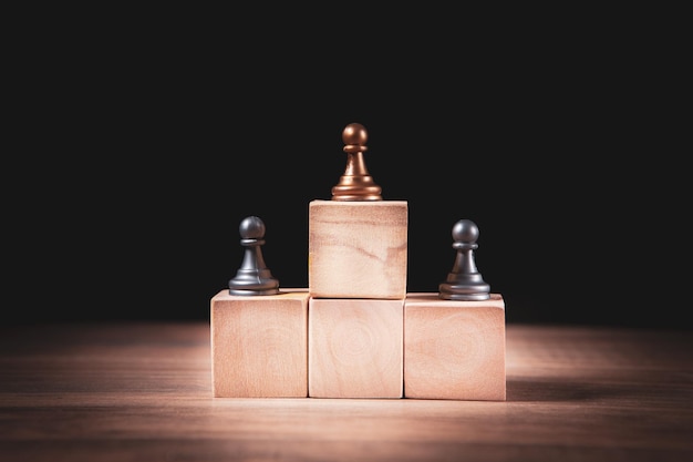 Top of golden chess pawn pieces or leader businessman