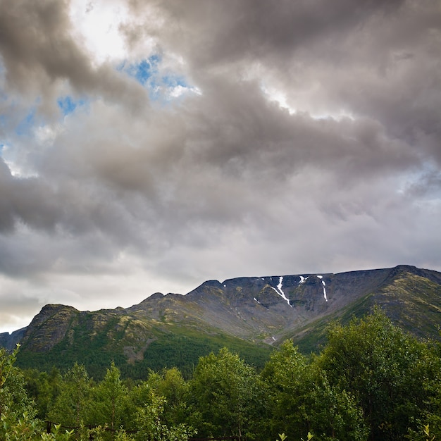 Top mountain Khibiny in the form of a surface of the cloudy sky