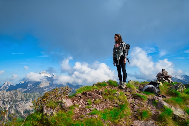 At the top of the mountains A lonely girl looks at the view