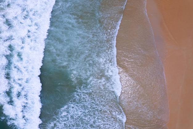 Top view of amazing waves beach and turquoise sea copy space available nature background High angle view sea Summer season greeting background