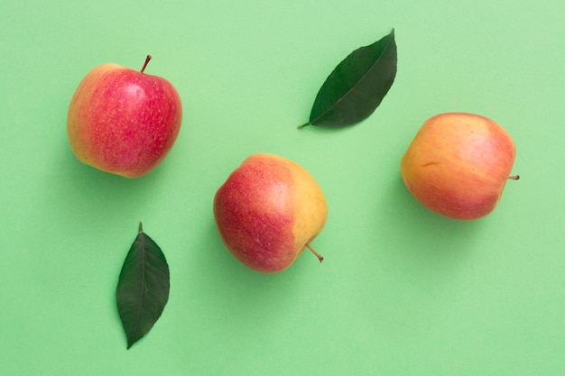 Top view apples with leaves