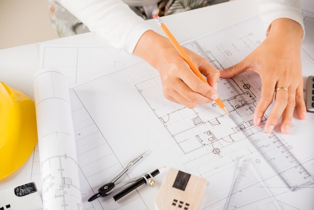 Top view of architect drawing with ruler on house plan blueprint paper for repair tools