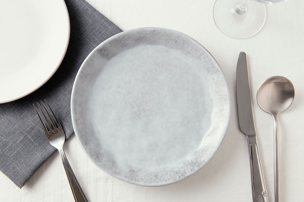 Top view arrangement of beautiful tableware on the table