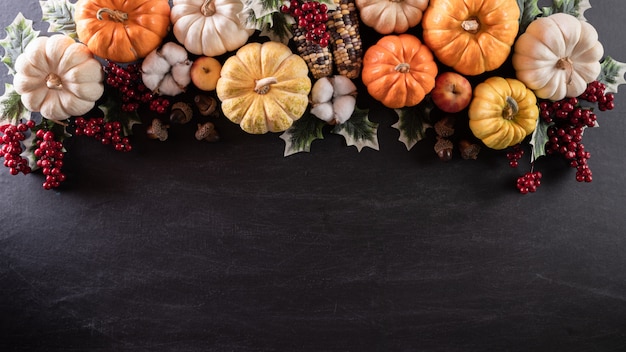 Top view of Autumn maple leaves with Pumpkin for Thanksgiving day concept.