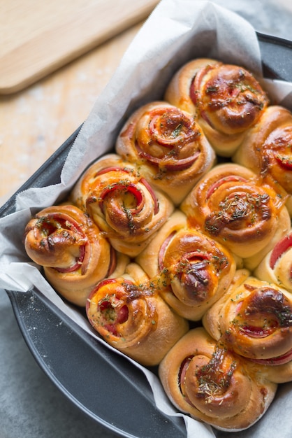 Top view of baked bologna roll in baking tray