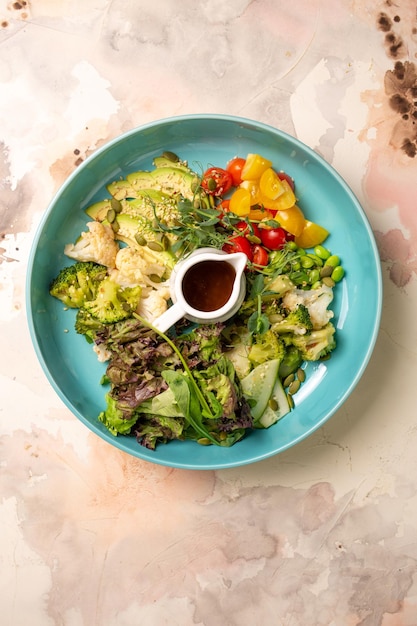 Top view of a Balanced Diet Plate With Vegetables Salad And Dressing Salad Bowl