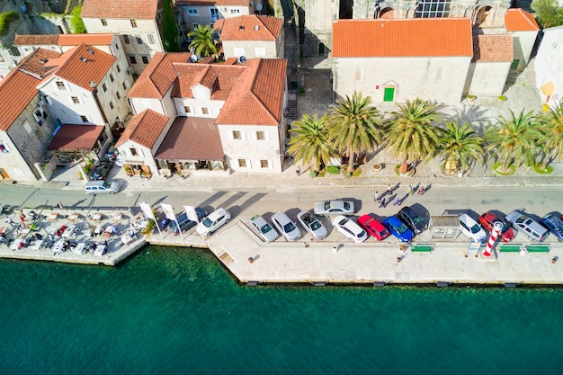 Top view of a beautiful city with red roofs near the sea