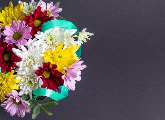 Top view of beautiful colorful bouquet of flowers isolated on grey background