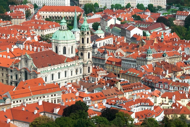 Top view of the beautiful old city with redtiled roofs and spiers Toned