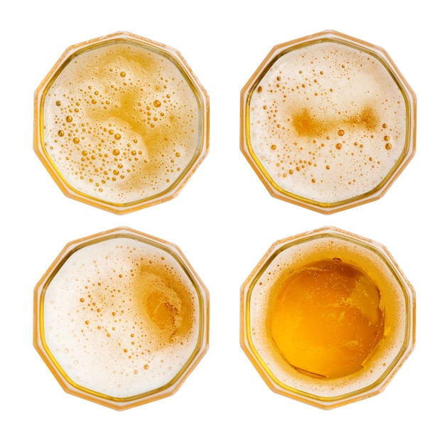 Top view of Beer bubbles in glass cup isolated on white background.