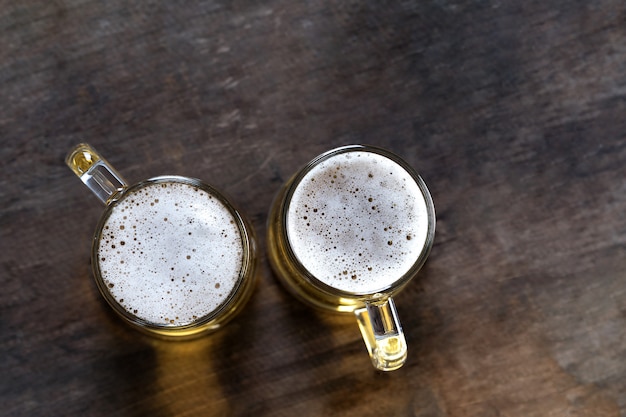 Top view of Beer in glass on the wooden table background