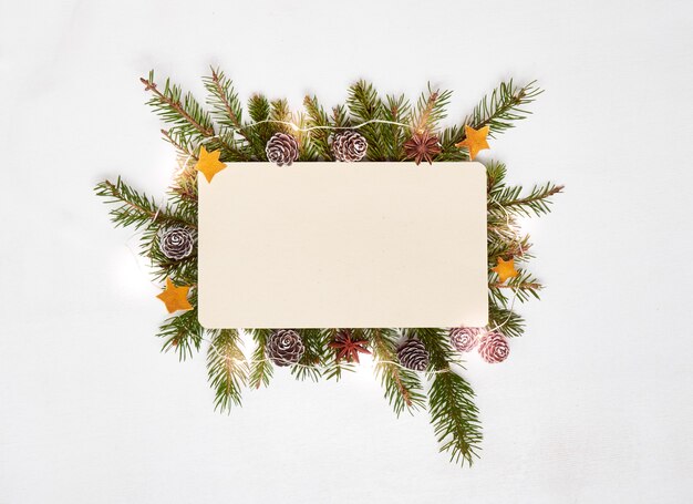 Top view of blank paper with spruce branches