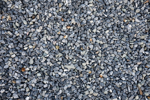 Top view of blue construction gravel texture background. Small granite stone full frame background.