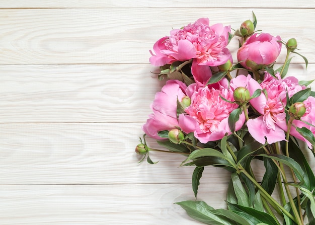 Top view of bouquet of pink peonies with copy space