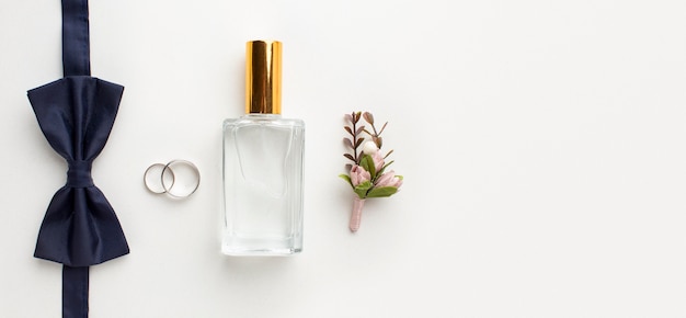 Top view bow tie and perfume wedding concept