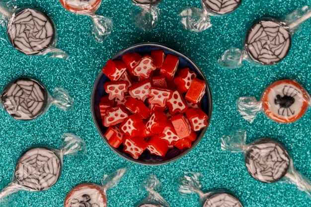 Top view bowl of halloween candies on a bright background