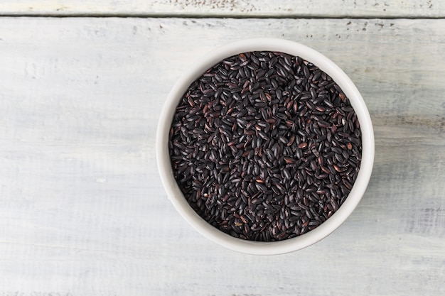 Top view of bowl with black rice