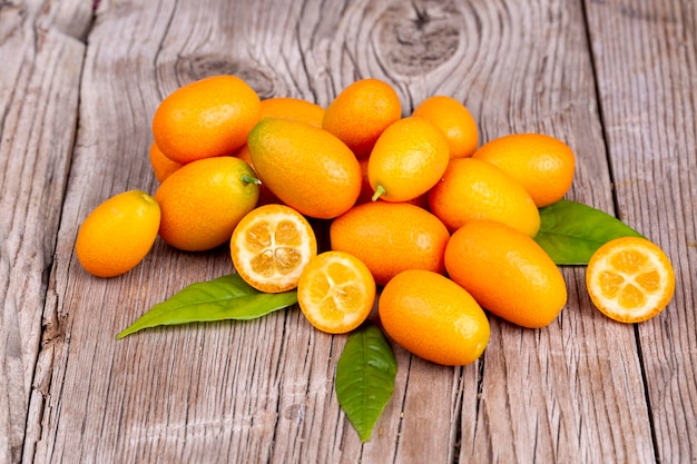 Top view of bunch of fresh kumquats in the organic food market.