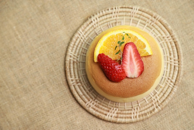 Top view of burn cheese cake with strawberry lemon for eating