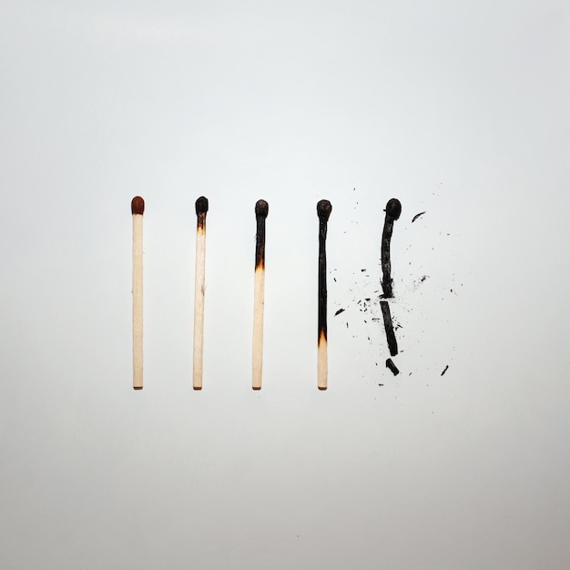 Top view burnt matches on paper