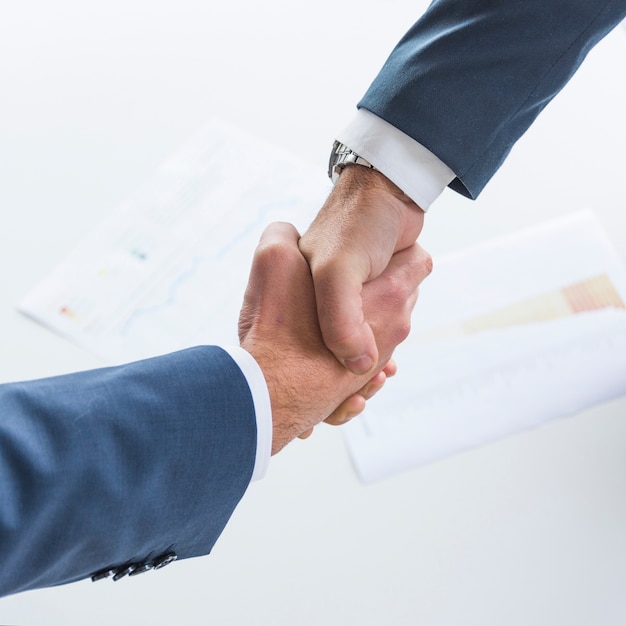 Top view of business people shaking hands together