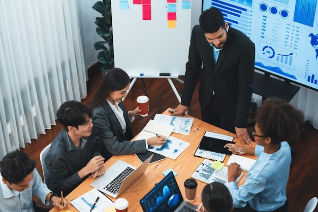 Top view business presentation with data analysis dashboard on TV screen in modern meeting room Business people brainstorming or working together to plan business marketing strategy Concord