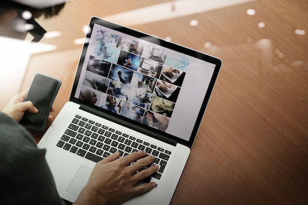 Top view of businessman hand working with new modern computer and smart phone and business strategy