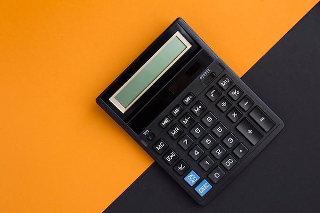 Top view of calculator on the colored background. Close-up. Copy space.