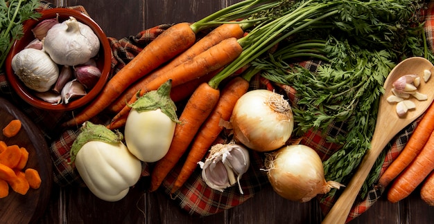 Top view of carrots with onions and garlic