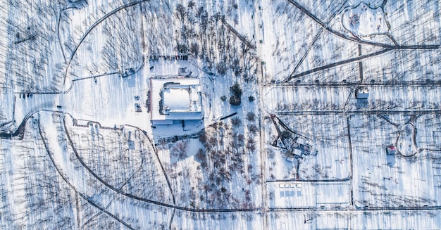 Top view of central city park during winter with snow aerial view of winter urban park with no peopl