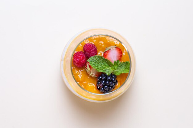 Top view Chia seed pudding with fresh berries and mint