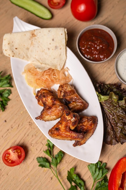 top view of chicken wings kebab barbecue on the table in a cafe