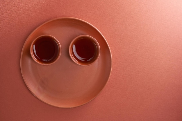 Top view chinese tea cup against red background