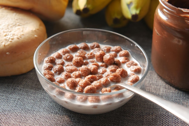 top view of chocolate corn flakes in a bowl on table