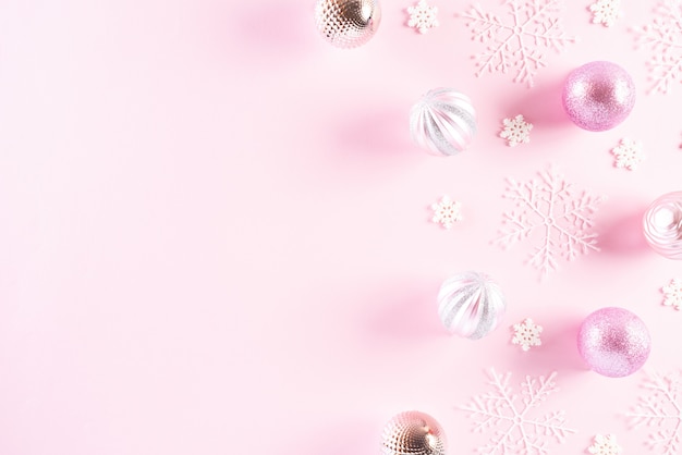 Top view of Christmas decoration  on pink background.