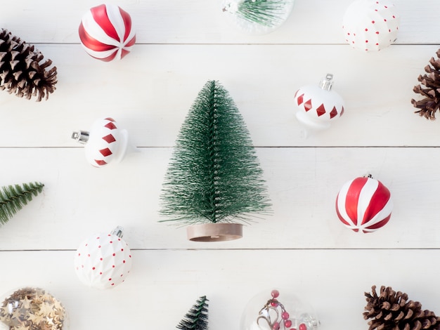 top view of Christmas decoration with pine cones, tree toy and balls