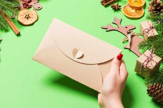 Top view christmas decorations with an envelope