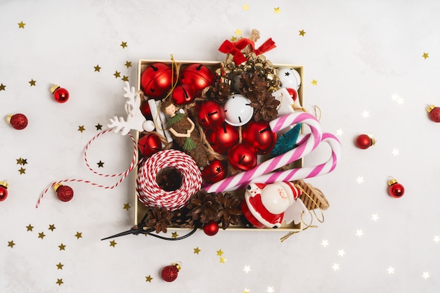 Top view of Christmas props tree toys in a box over on white background 