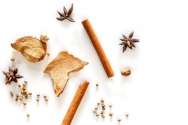 Top view of cinnamon stick and dried ginger isolated on white background