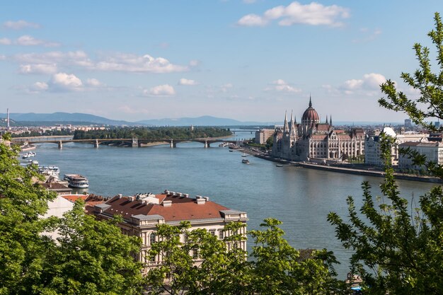 Top view of the city of Budapest in Hungary the Danube river bridges the Parliament building on a warm sunny day