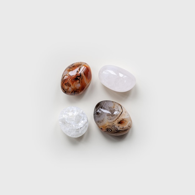 Top view close up pebbles stones on white light background Square composition from natural