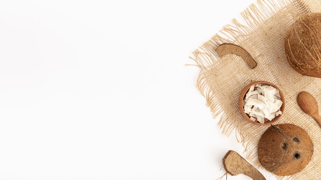 Top view of coconut on burlap with copy space