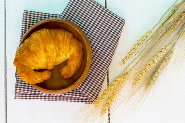 top view coffee and croissant with coffee bean