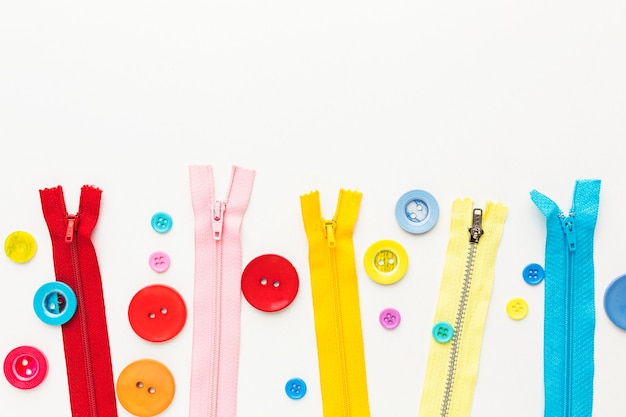 Top view of colorful buttons and zippers